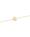 Gold bracelet with a small princess charm on a white background