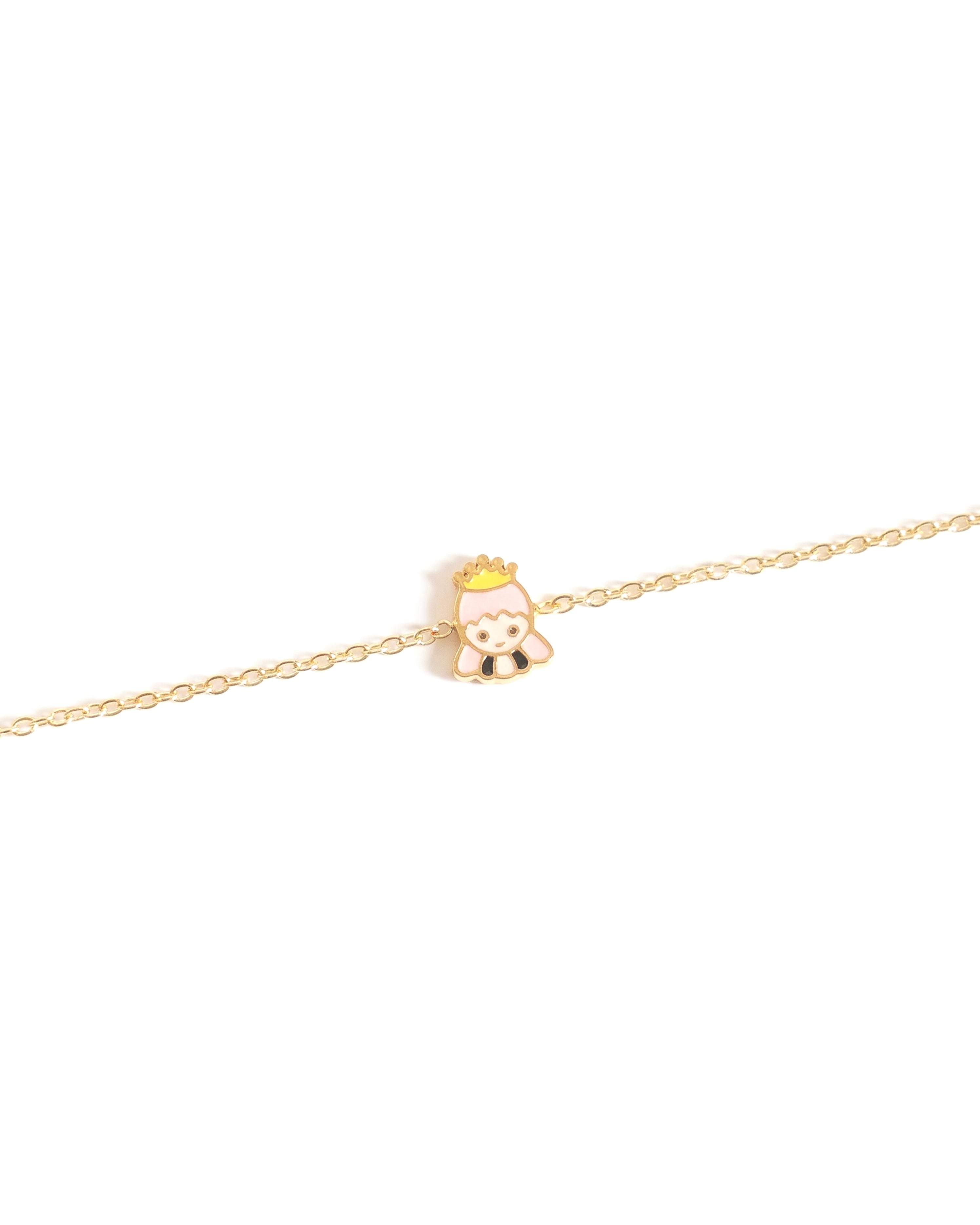 Gold bracelet with a small princess charm on a white background